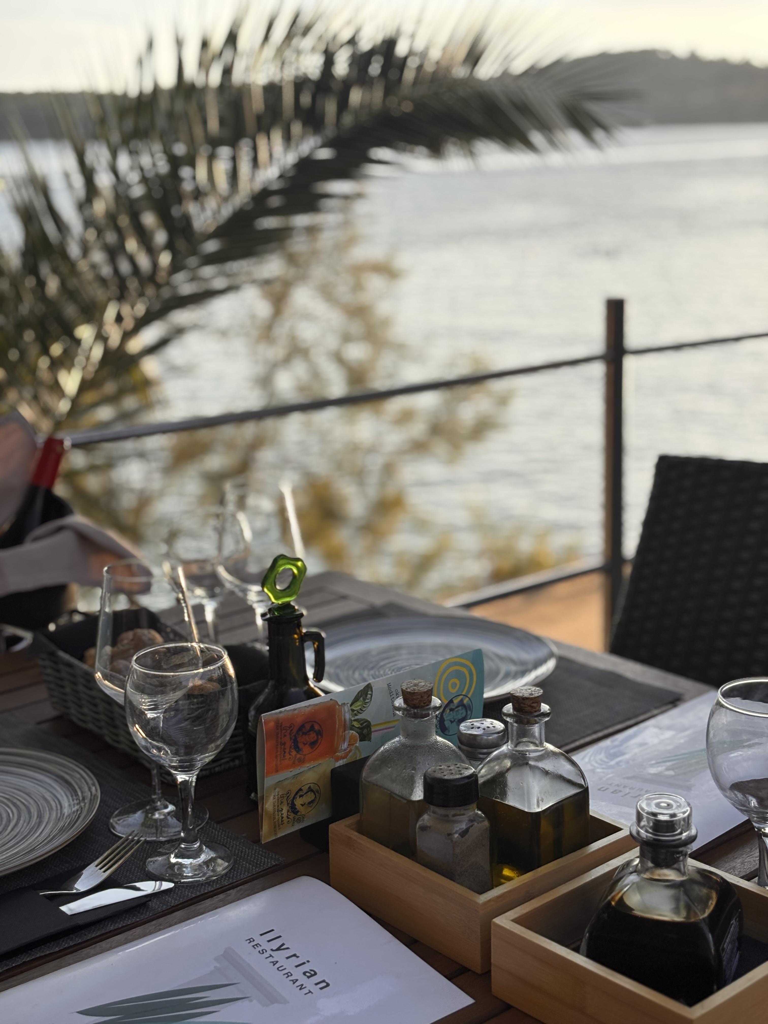 Table setting with Illyrian menu and sea view