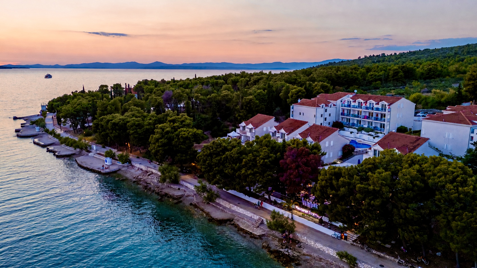 Aerial sunset view of the Milna seafront where Restaurant Illyrian sits, island of Brač