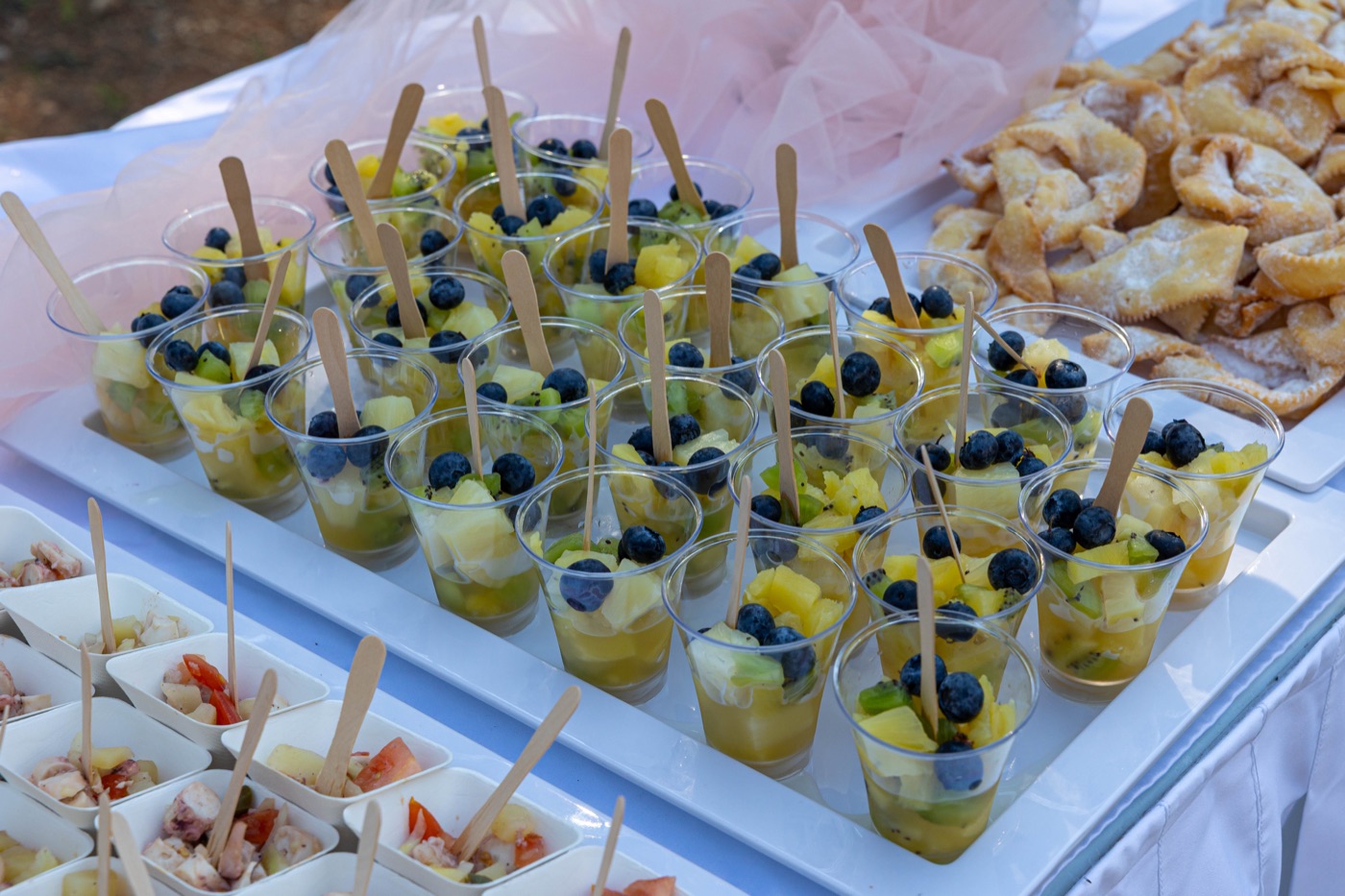 Fruit dessert cups plated for wedding guests