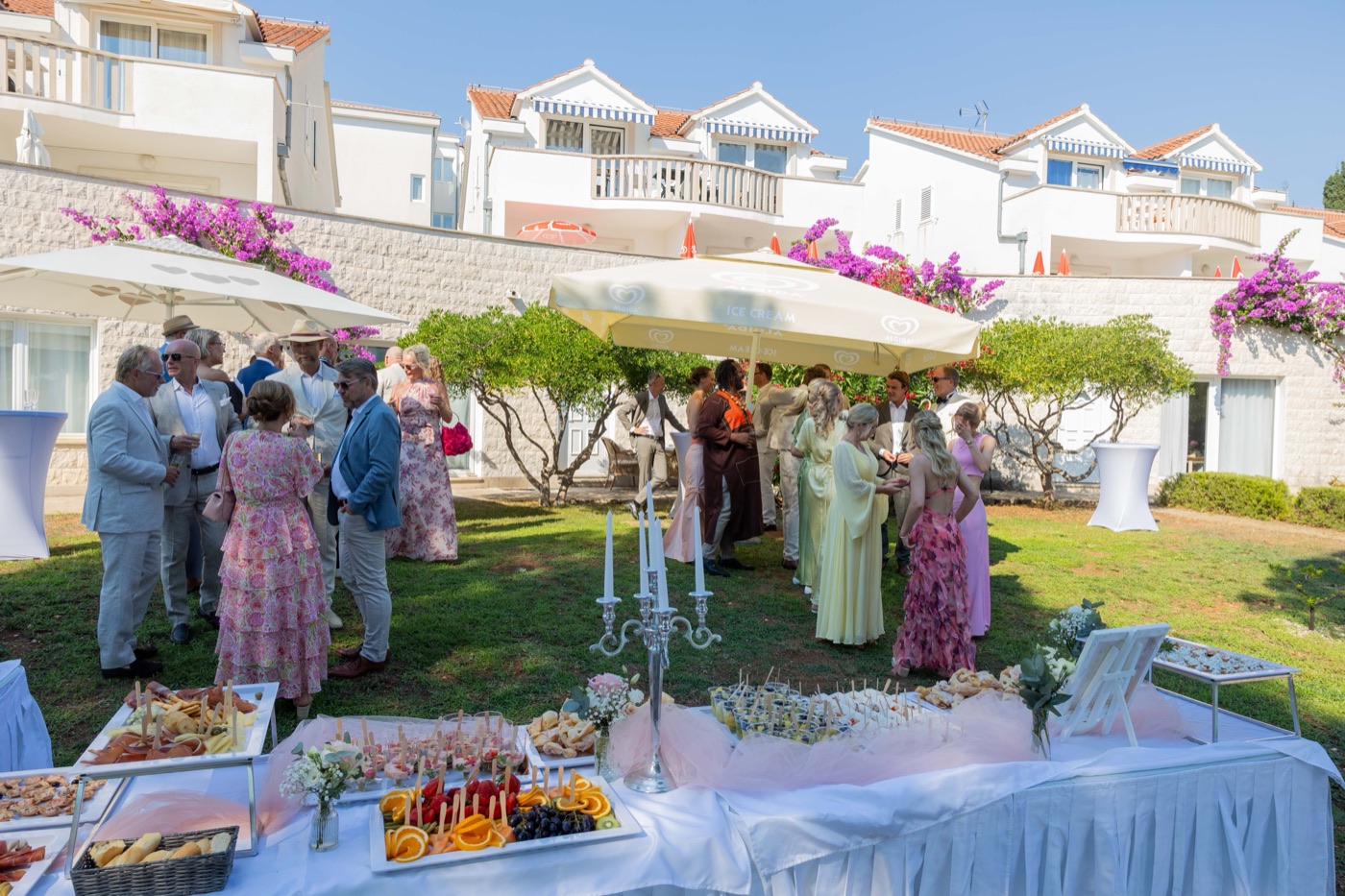 Guests mingling in the garden during a wedding reception